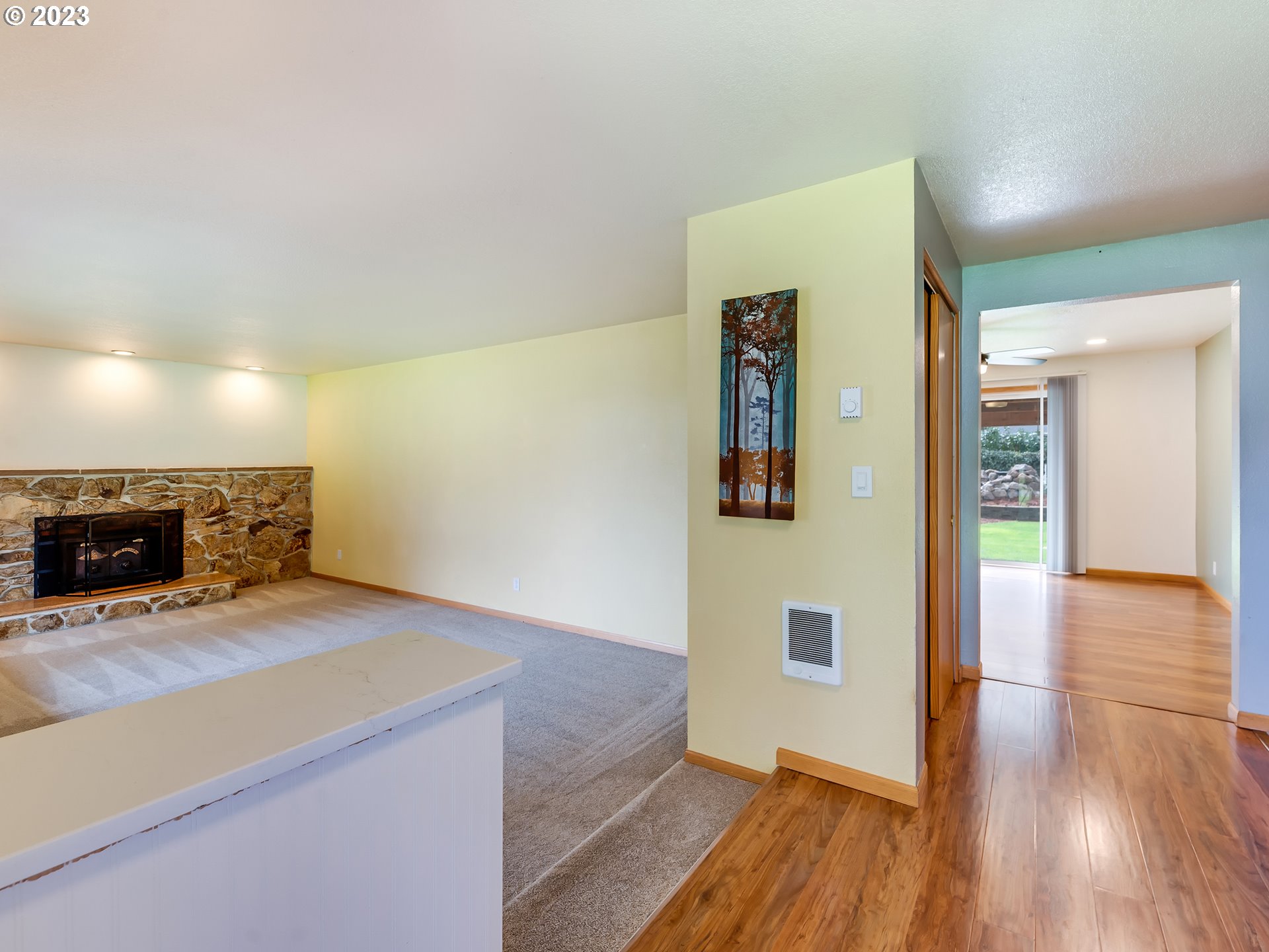 3817 Hayden Bridge Road Springfield, OR 97477 - Photo 4 of 33 a view of an empty room and wooden floor