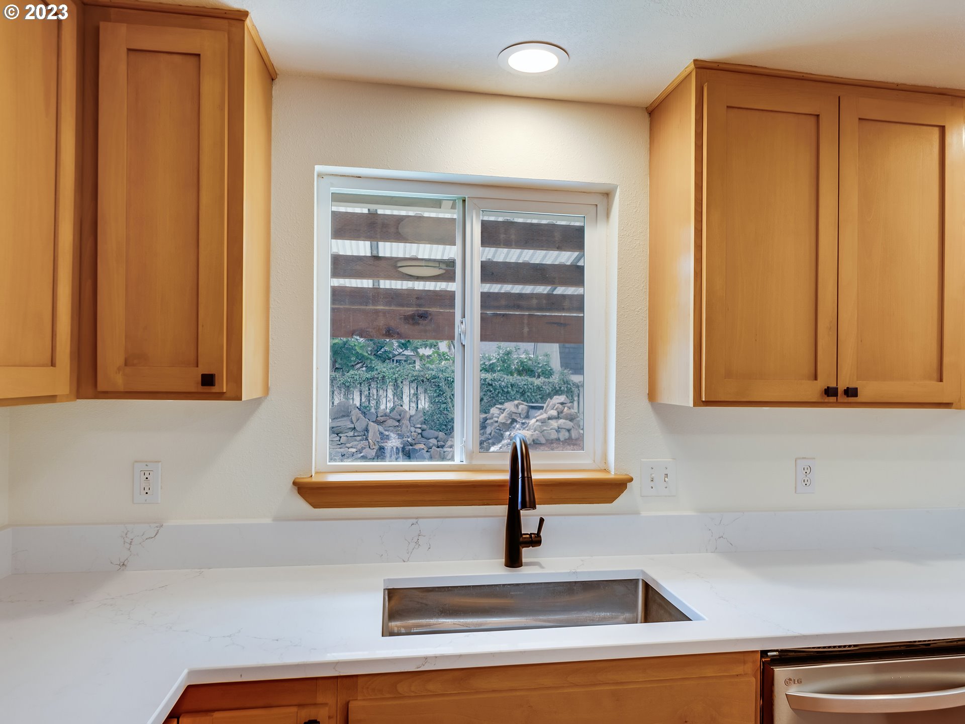 3817 Hayden Bridge Road Springfield, OR 97477 - Photo 8 of 33 a kitchen with a sink and a window