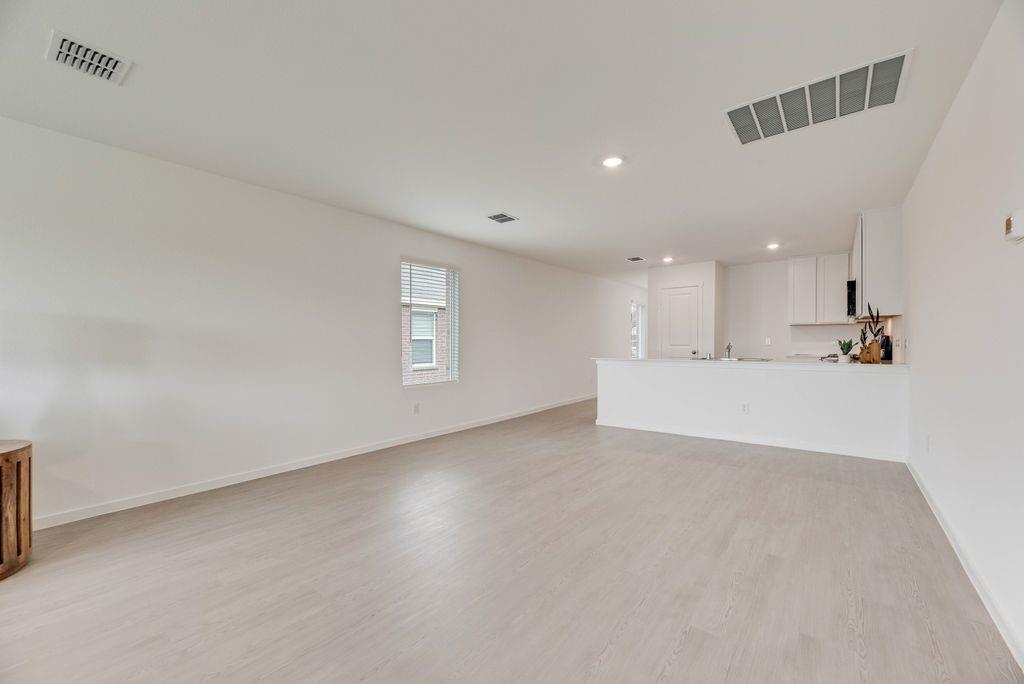 1272 Balsam Road Wilmer, TX 75172 - Photo 22 of 31 a view of a kitchen with a sink and a window