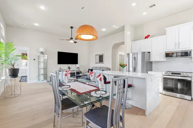 a view of a lake with houses in back