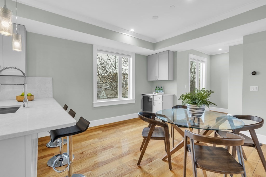 17 Vinton Street, Unit PH Boston, MA 02127 - Photo 15 of 36 a workspace room with furniture and wooden floor