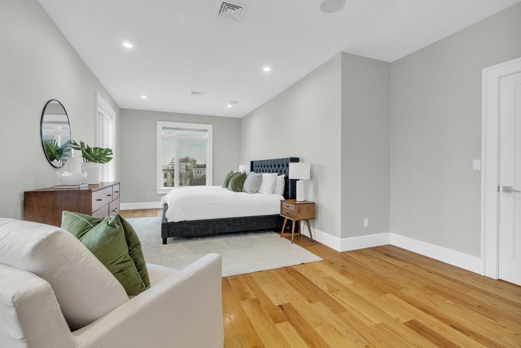 17 Vinton Street, Unit PH Boston, MA 02127 - Photo 17 of 36 a bedroom with a bed couch and window