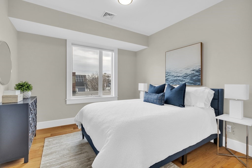17 Vinton Street, Unit PH Boston, MA 02127 - Photo 20 of 36 a bedroom with a bed and window