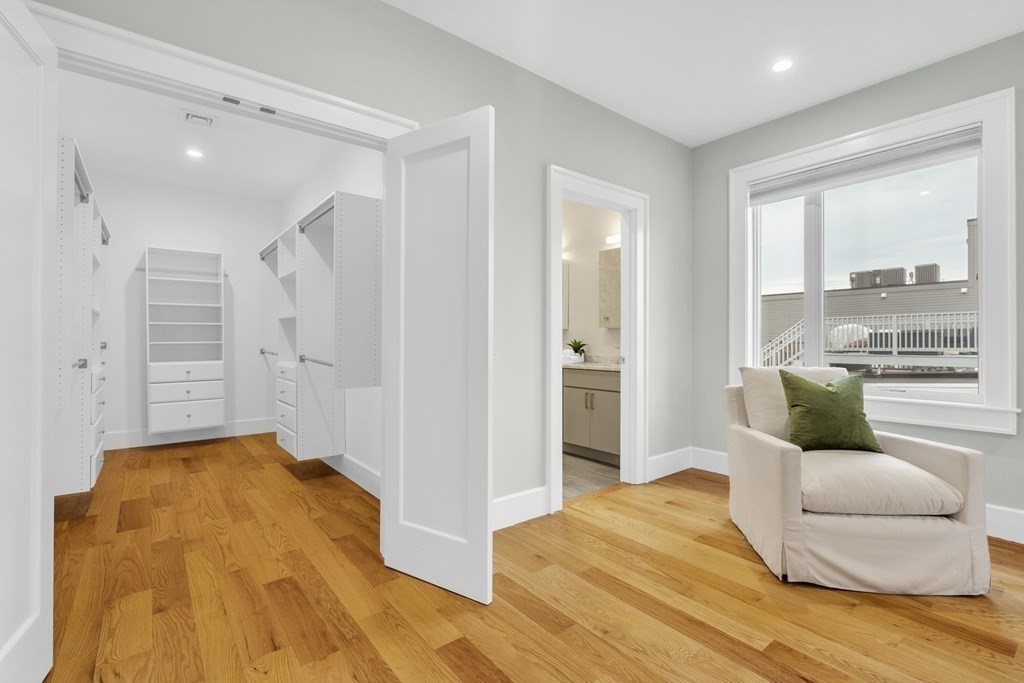 17 Vinton Street, Unit PH Boston, MA 02127 - Photo 23 of 36 a bedroom with a bed and a couch