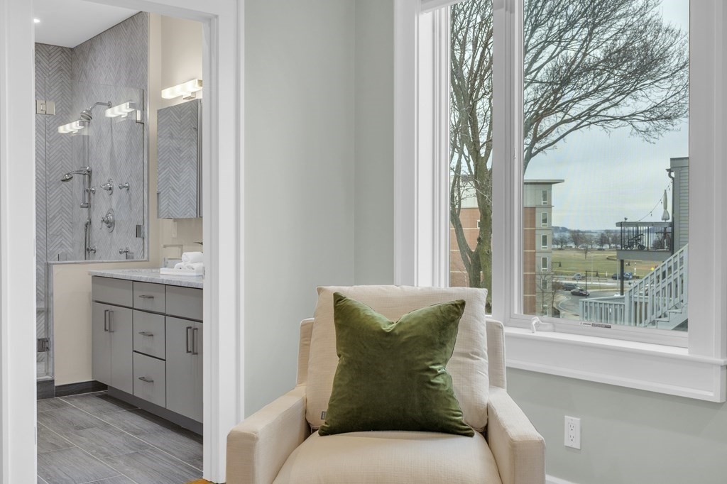 17 Vinton Street, Unit PH Boston, MA 02127 - Photo 24 of 36 a spacious bathroom with a double vanity sink and a mirror
