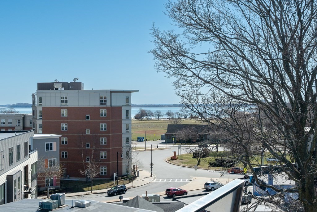 17 Vinton Street, Unit PH Boston, MA 02127 - Photo 35 of 36 a view of a brick building next to a road with building