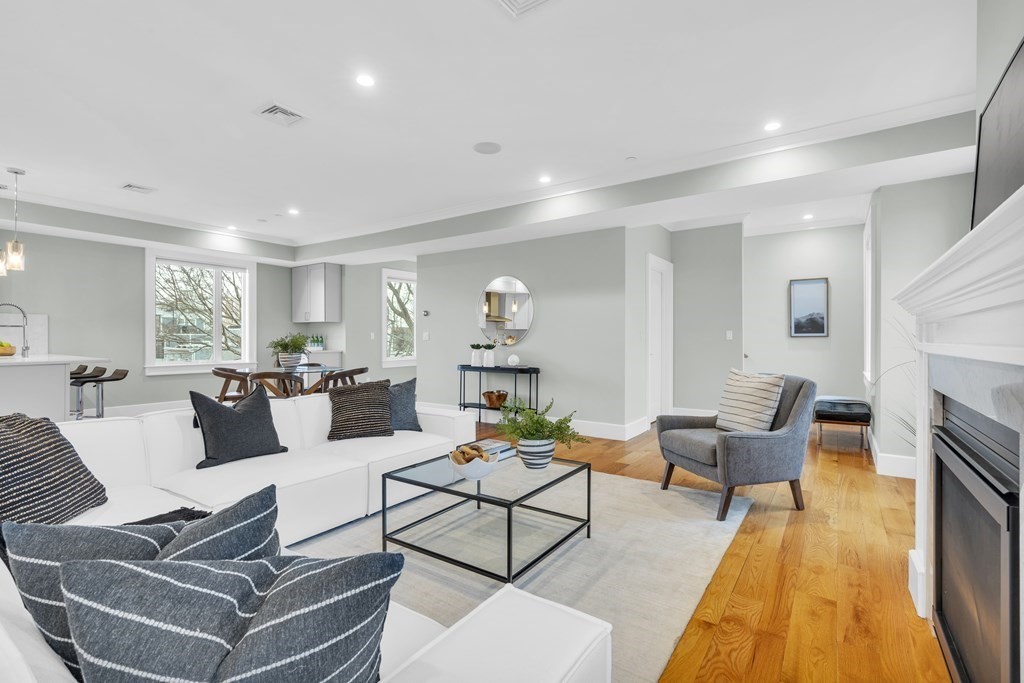 17 Vinton Street, Unit PH Boston, MA 02127 - Photo 6 of 36 a living room with furniture and a fireplace
