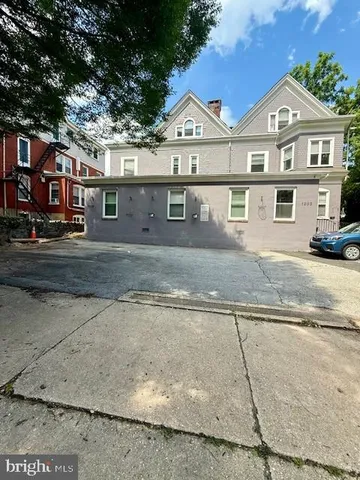 front view of a house with a street