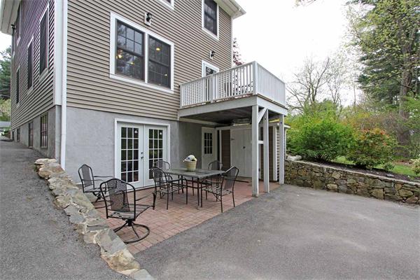 23 Wallace Road Wayland, MA 01778 - Photo 23 of 25 a view of a house with backyard and sitting area