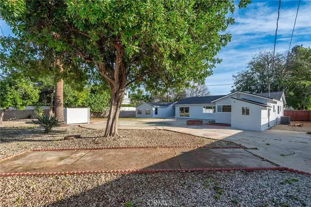 a house with a tree in front of it