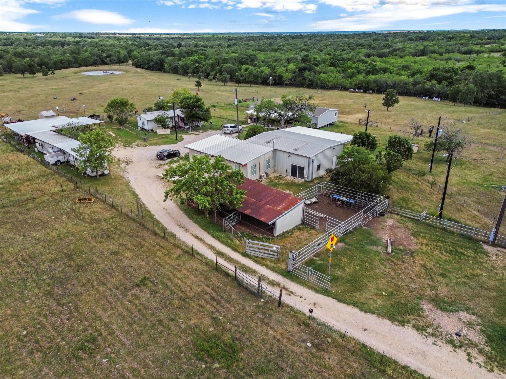 480 Grandpa Road Lockhart, TX 78644 - Photo 5 of 35 The centerpiece is a spacious ~2,061 sq ft manufactured home, just 1.5
years old, with 4 bedrooms, 2 bathrooms, and a beautifully crafted 40' x 20' stone outdoor kitchen under a covered
roof with lighting—ideal for hosting under the stars.