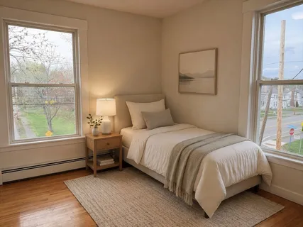 a bedroom with a bed and window