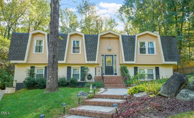 a front view of a house with garden