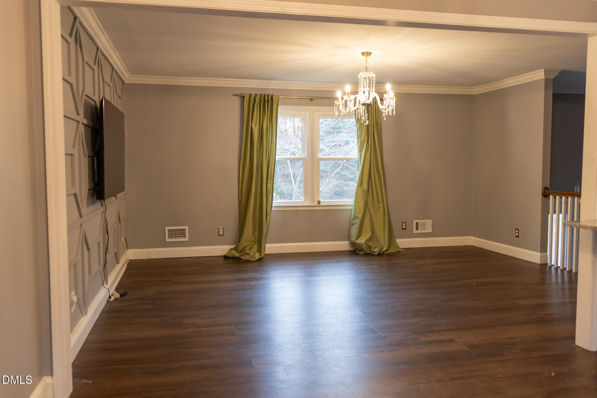 6708 Spencer Court Raleigh, NC 27615 - Photo 11 of 35 an empty room with wooden floor and windows
