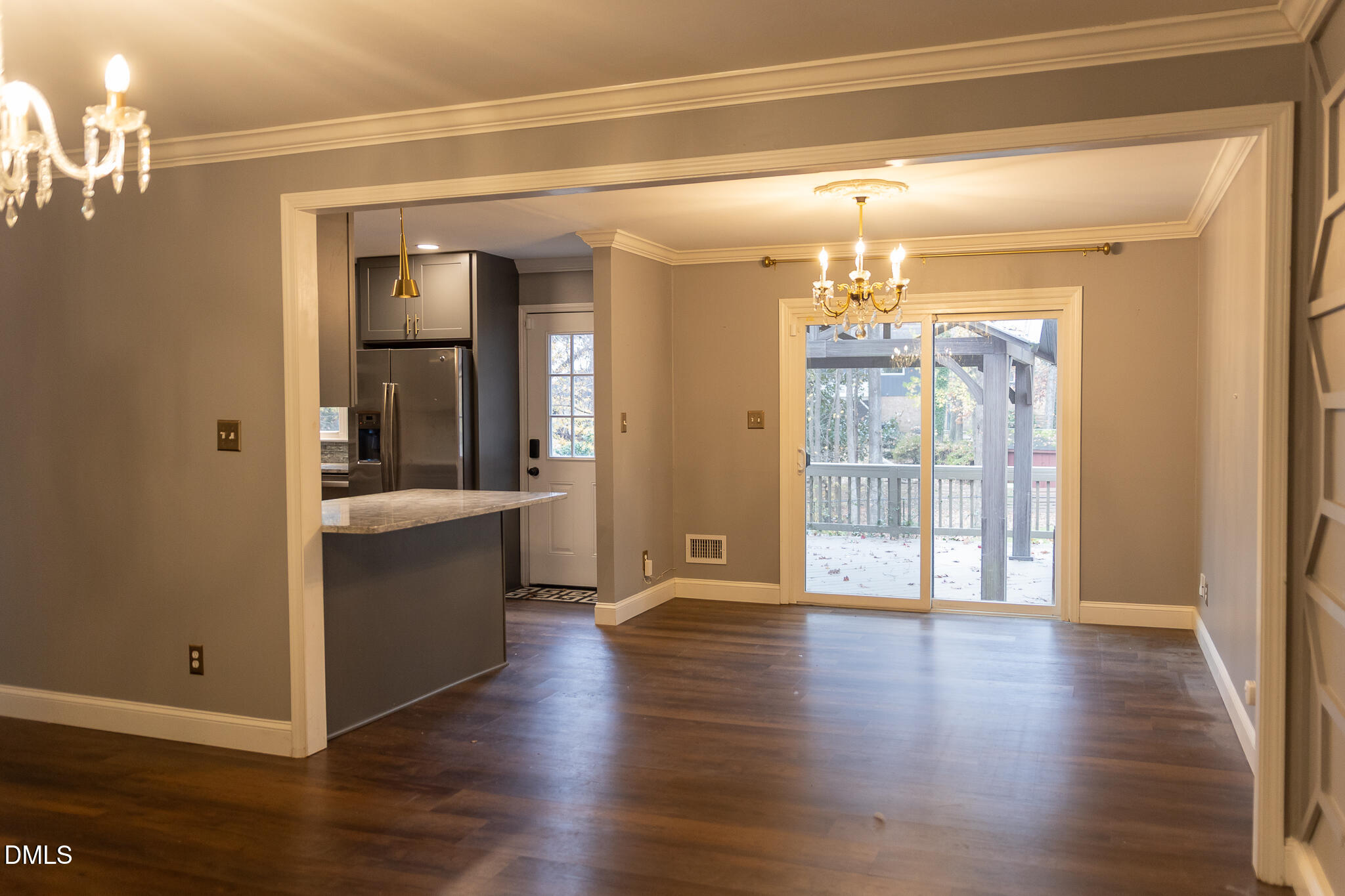 6708 Spencer Court Raleigh, NC 27615 - Photo 12 of 35 a view of a big room with wooden floor and windows