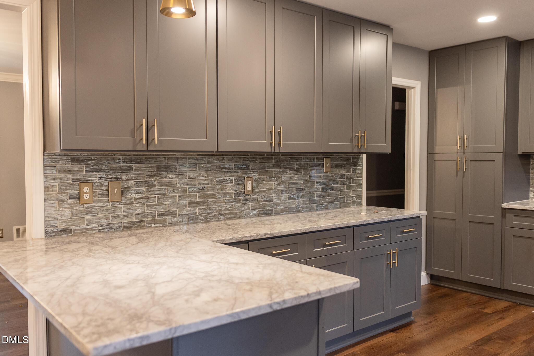 6708 Spencer Court Raleigh, NC 27615 - Photo 17 of 35 a kitchen with granite countertop a sink and cabinets