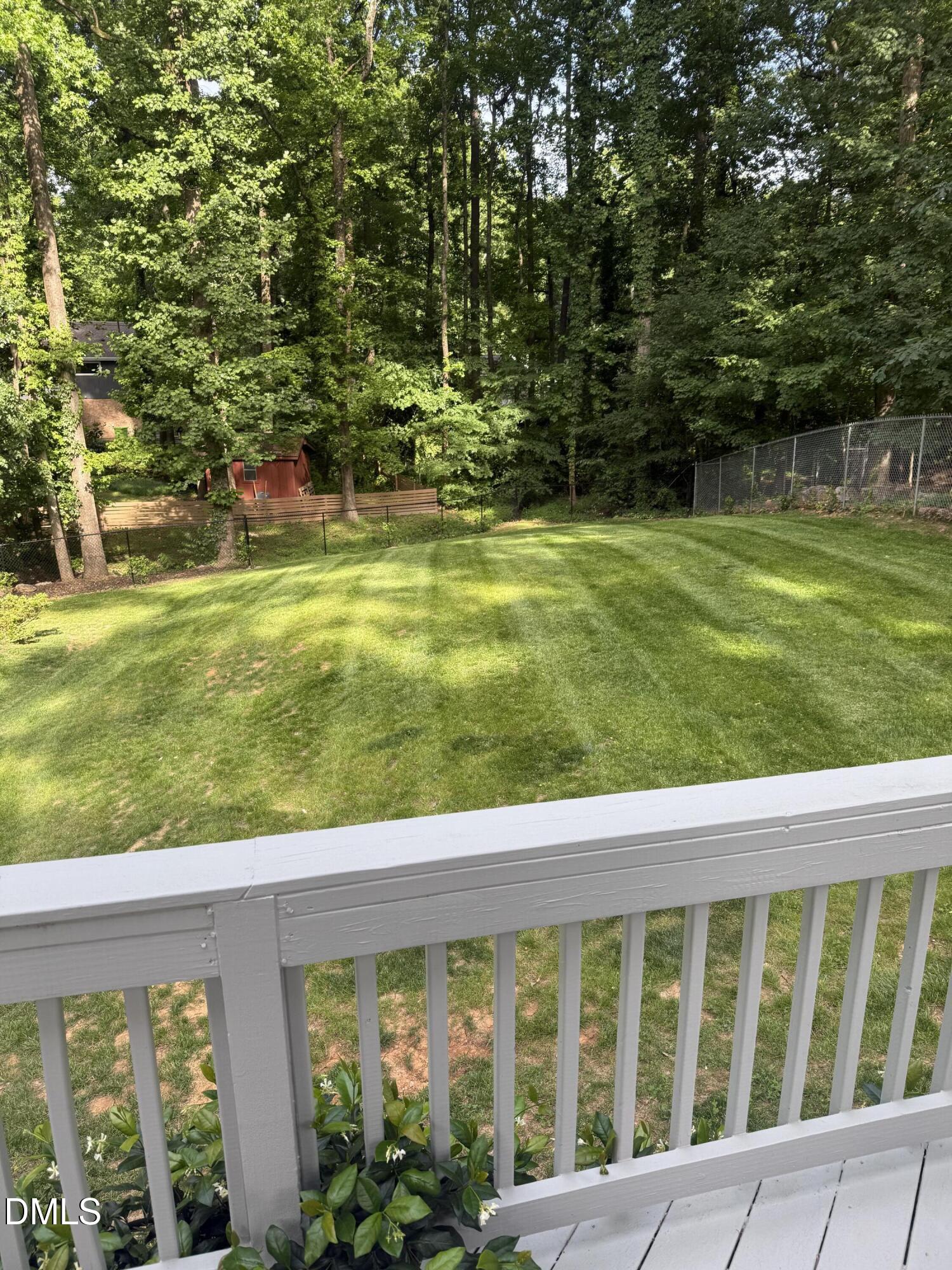 6708 Spencer Court Raleigh, NC 27615 - Photo 2 of 35 a view of a swimming pool with a garden