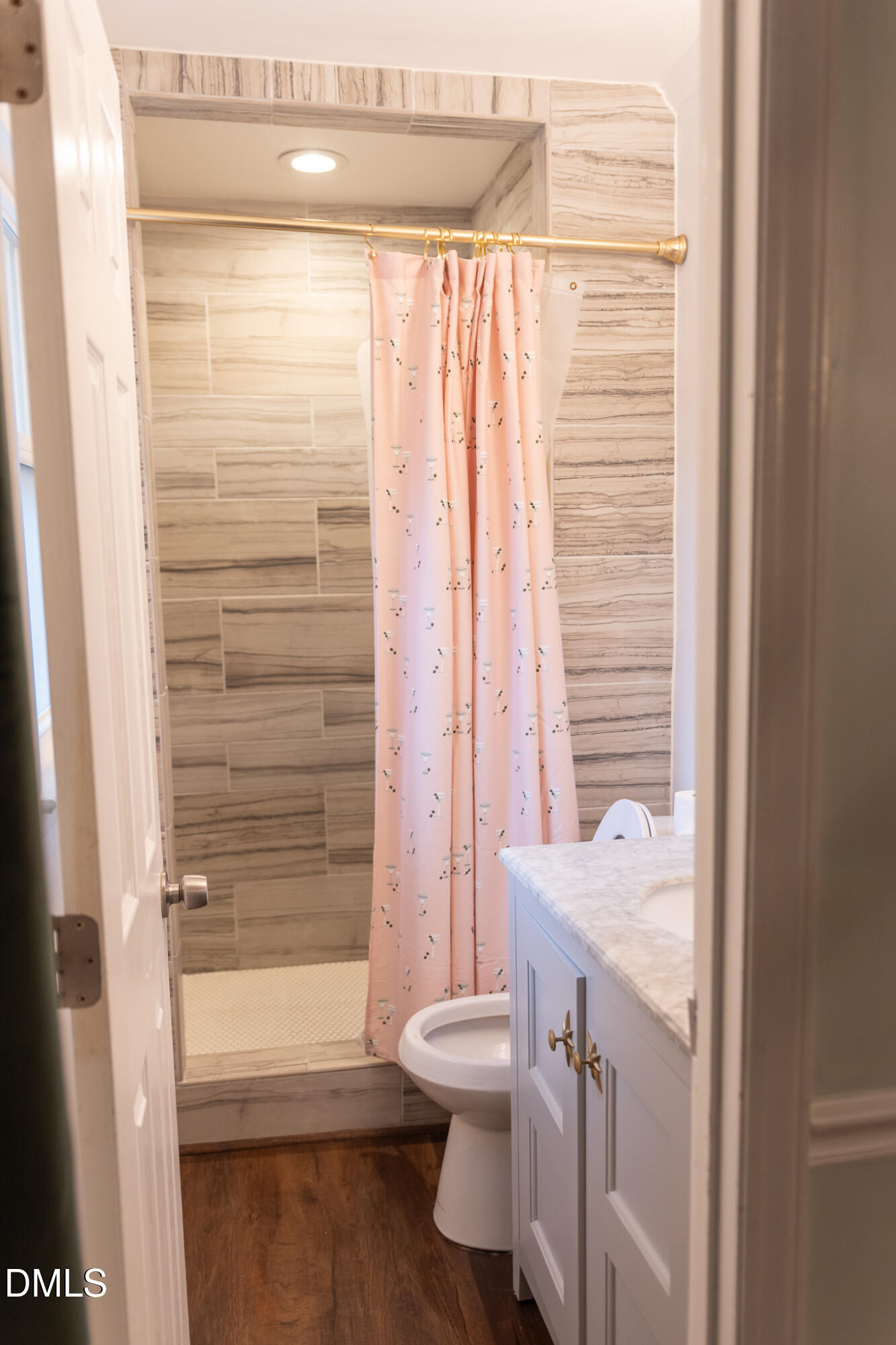 6708 Spencer Court Raleigh, NC 27615 - Photo 23 of 35 a bathroom with a sink a toilet and shower