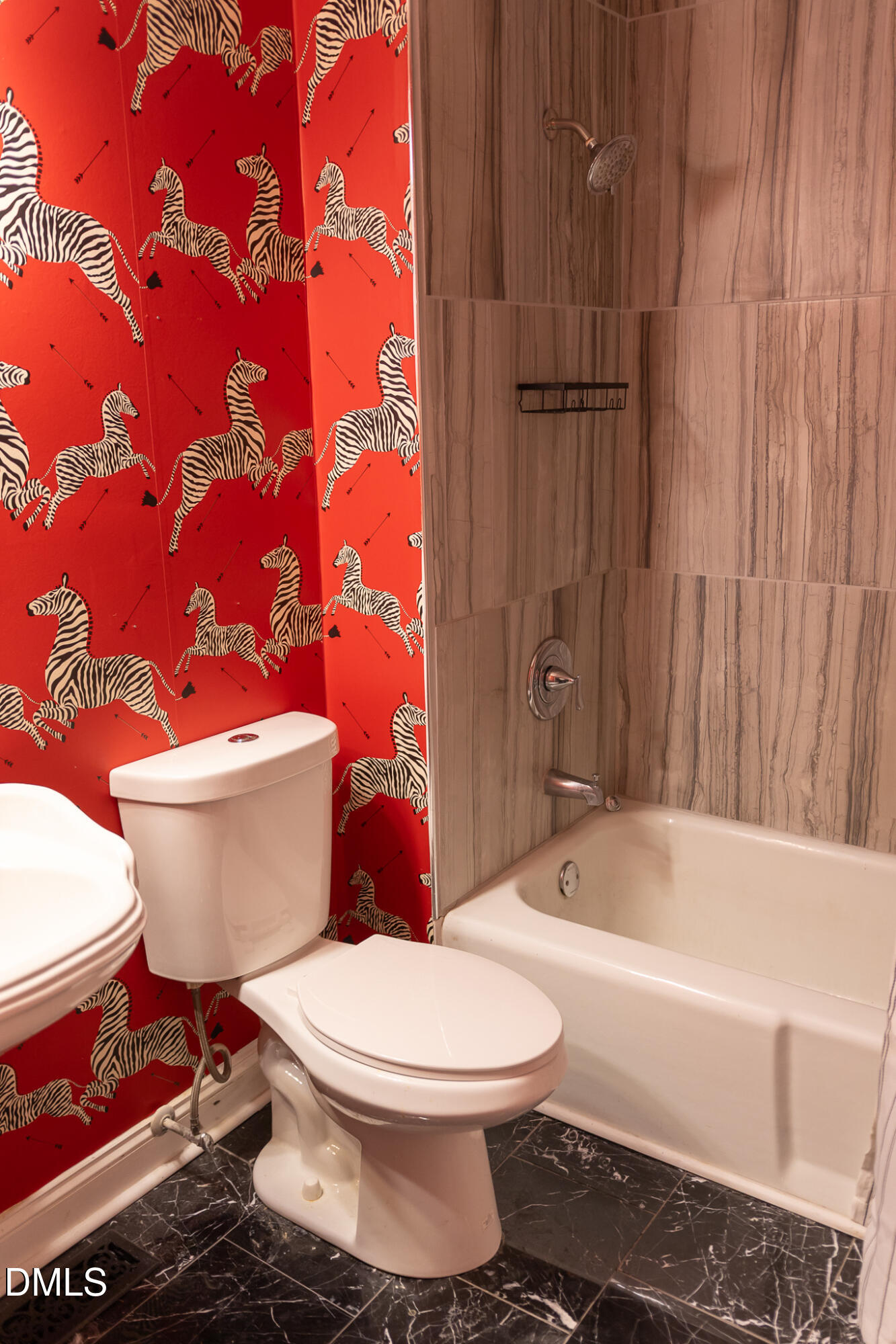 6708 Spencer Court Raleigh, NC 27615 - Photo 30 of 35 a white toilet sitting next to a bathroom sink and tub