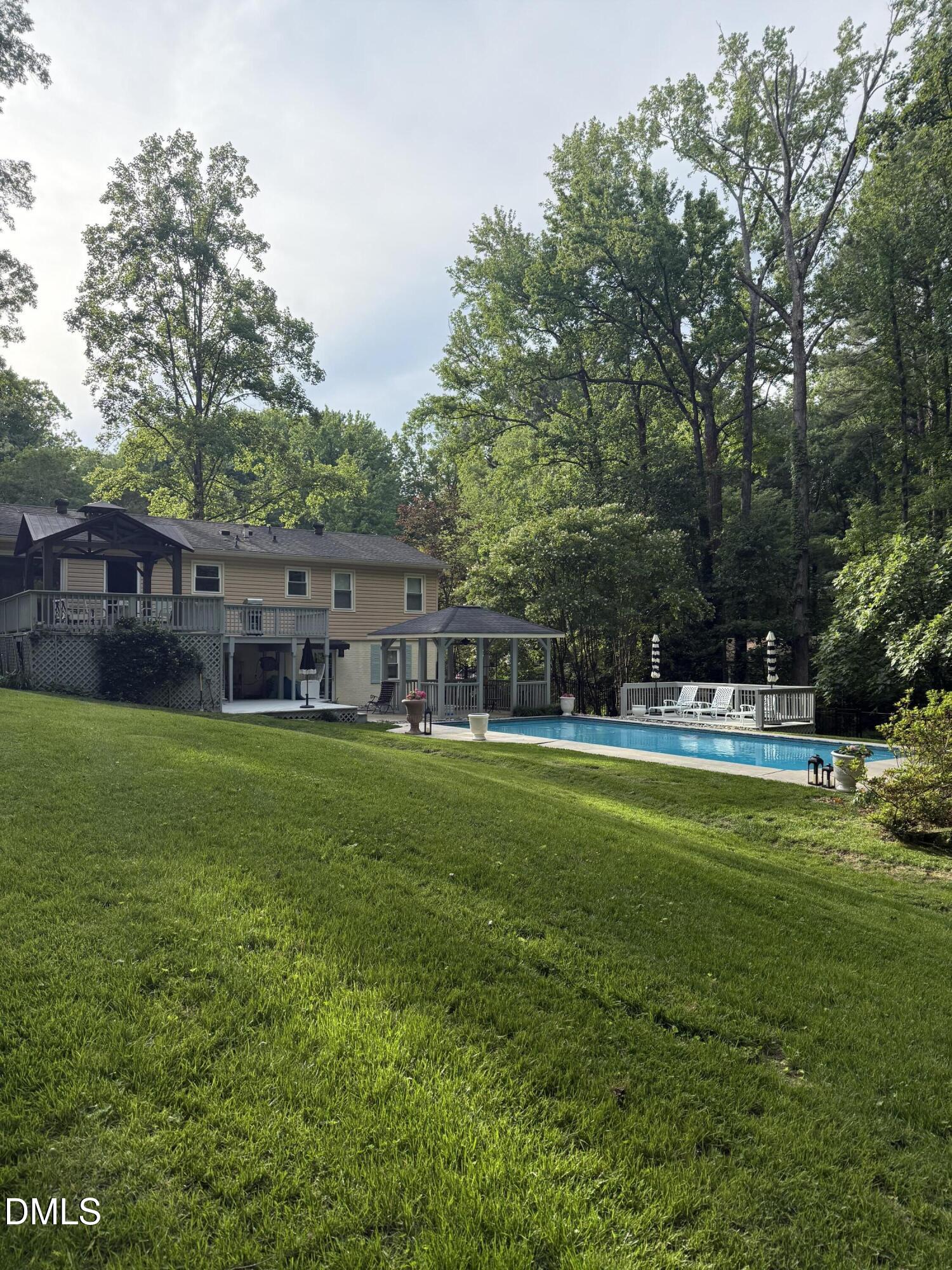 6708 Spencer Court Raleigh, NC 27615 - Photo 3 of 35 a view of a house with a big yard