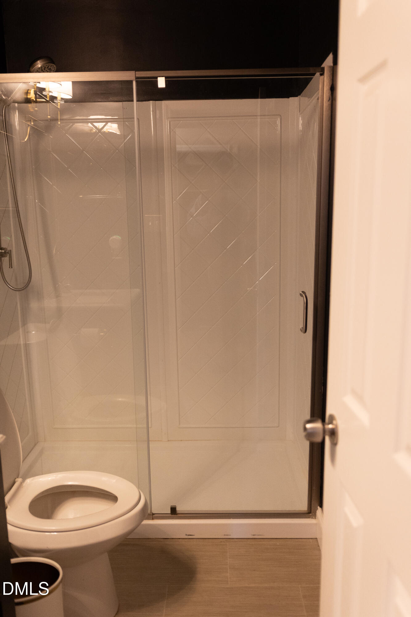 6708 Spencer Court Raleigh, NC 27615 - Photo 33 of 35 a bathroom with a shower and a toilet