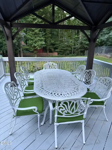 a view of a table and chairs in the patio