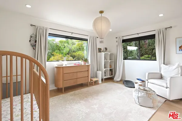 a room with furniture and a large window