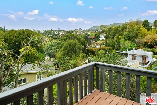 a view of a balcony with an outdoor space