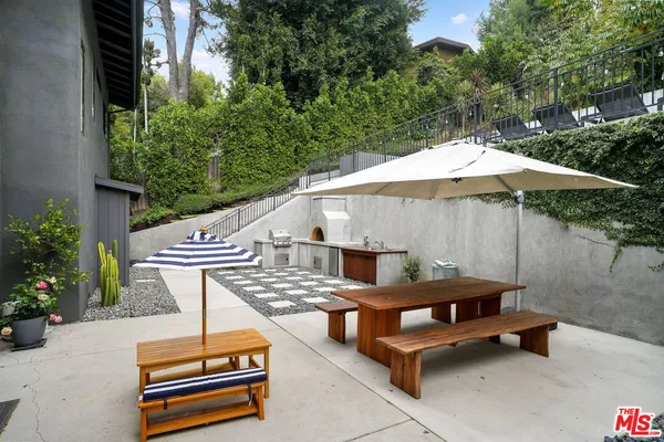 a swimming pool with outdoor seating