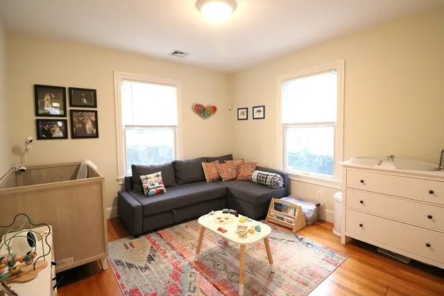 a living room with furniture window and a bed