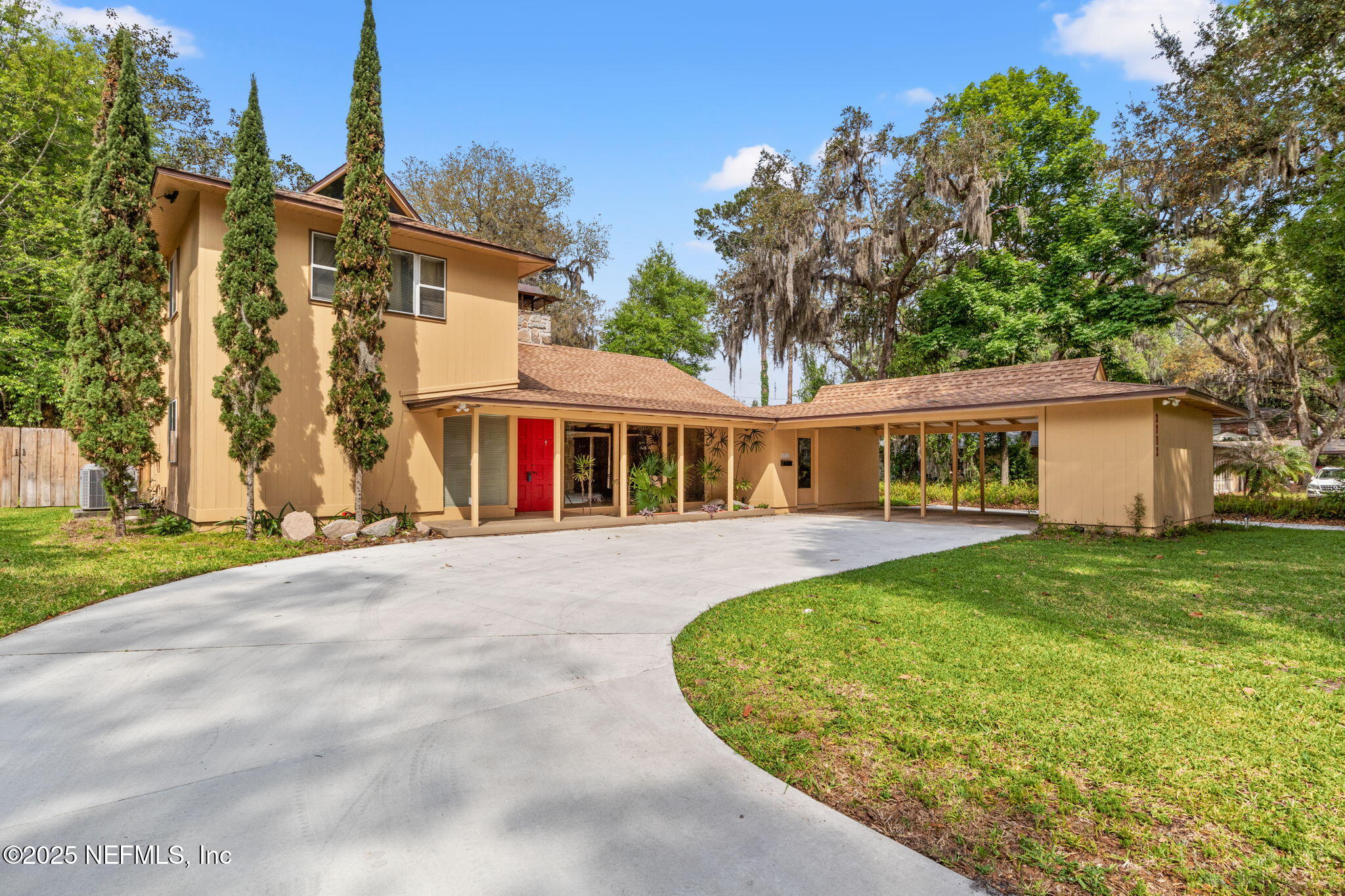 2712 Red Fox Road Orange Park, FL 32073 - Photo 1 of 30 a front view of a house with a garden