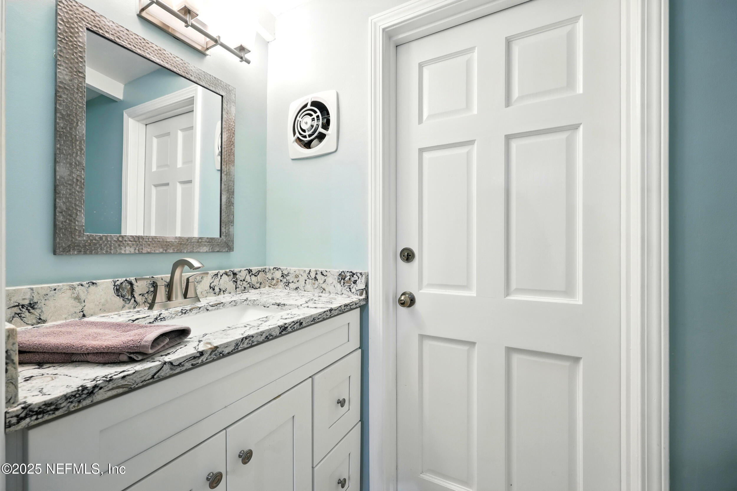2712 Red Fox Road Orange Park, FL 32073 - Photo 14 of 30 a bathroom with a sink and a mirror
