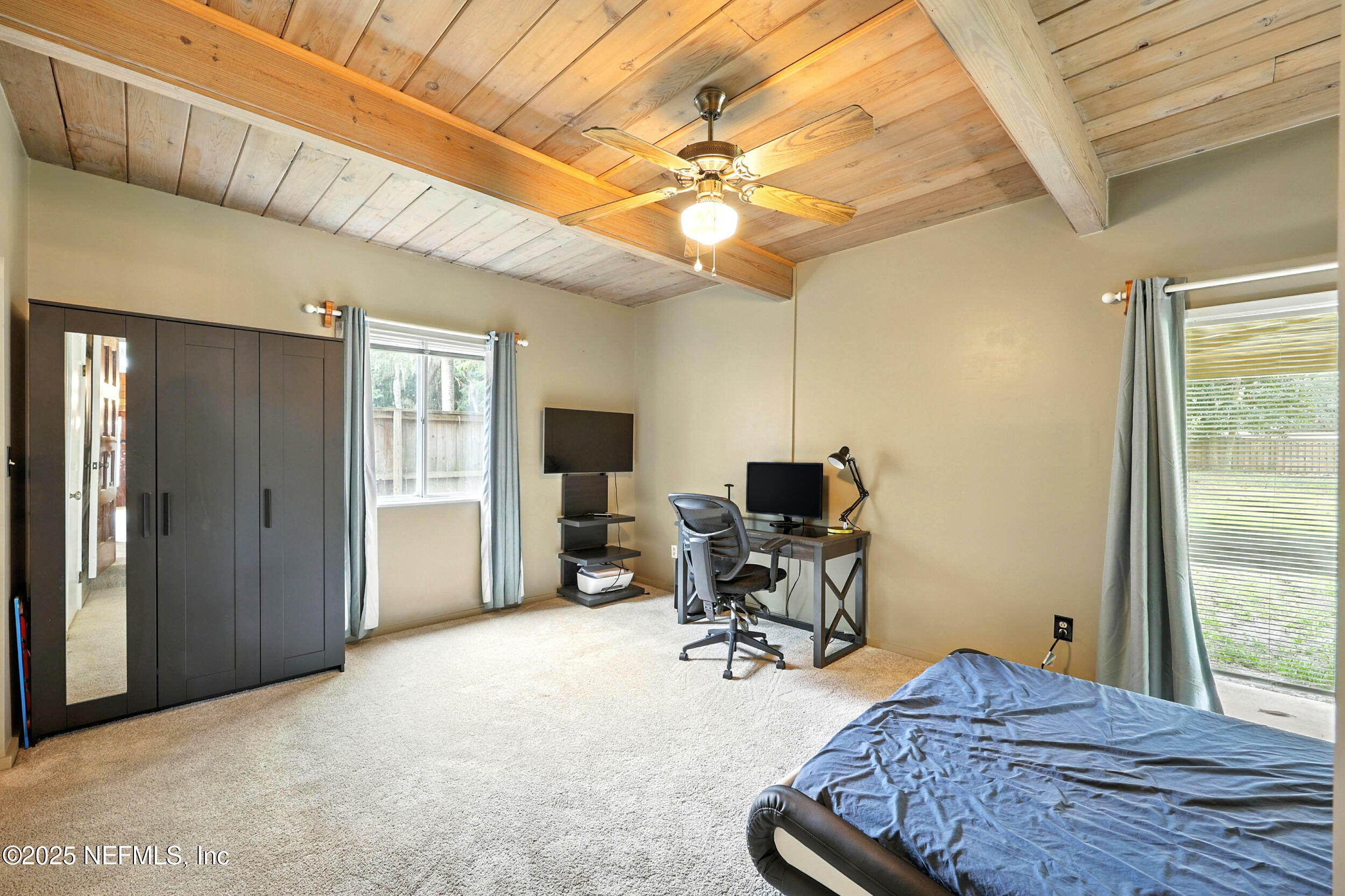 2712 Red Fox Road Orange Park, FL 32073 - Photo 15 of 30 a bedroom with furniture and a chandelier