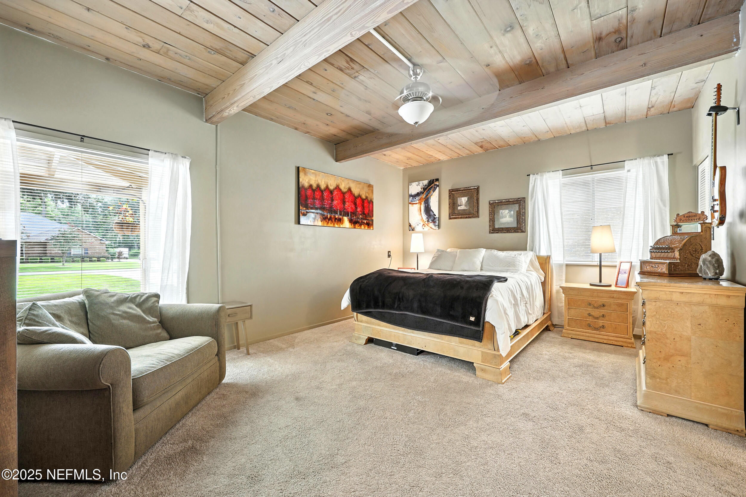 2712 Red Fox Road Orange Park, FL 32073 - Photo 17 of 30 a bedroom with furniture and a large window