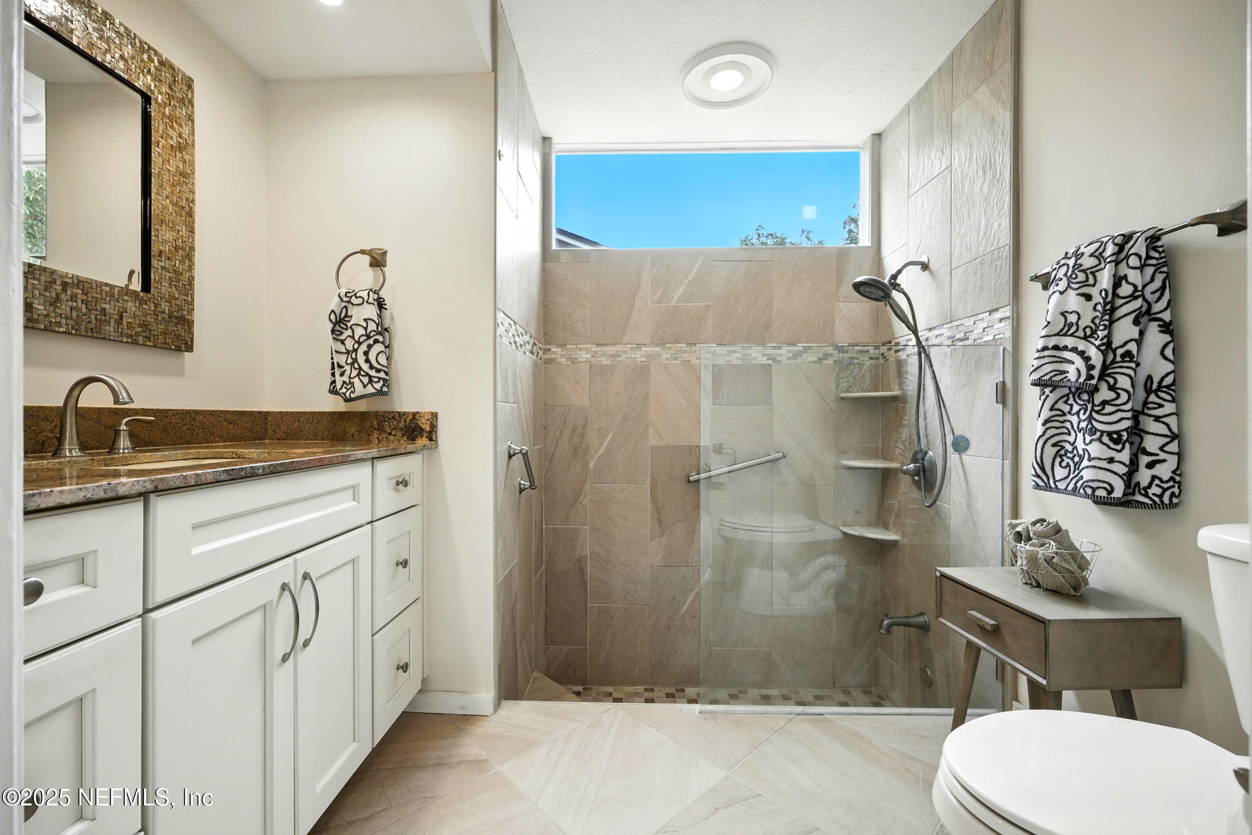 2712 Red Fox Road Orange Park, FL 32073 - Photo 20 of 30 a bathroom with a sink toilet and shower