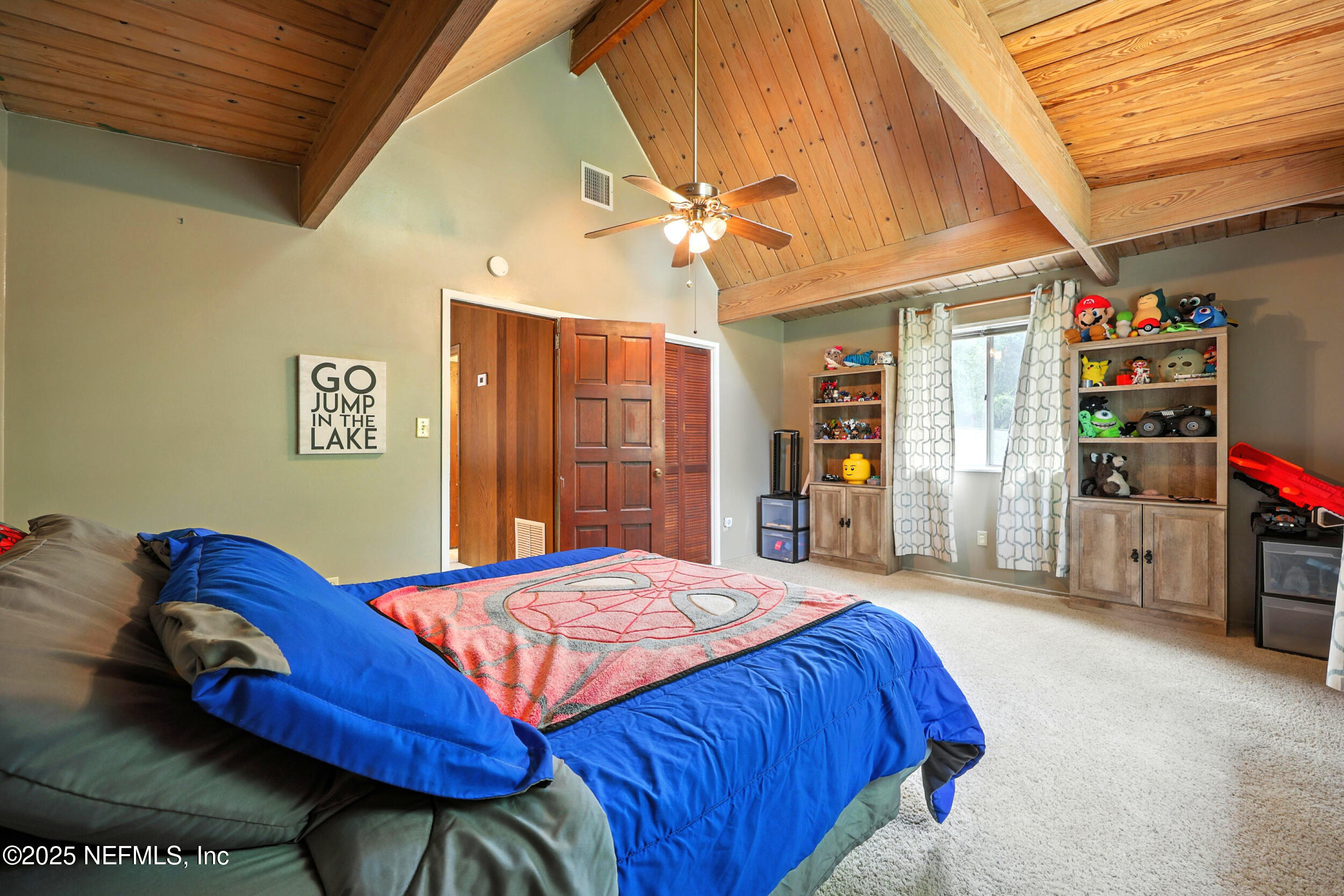 2712 Red Fox Road Orange Park, FL 32073 - Photo 23 of 30 a bedroom with a bed and a large closet