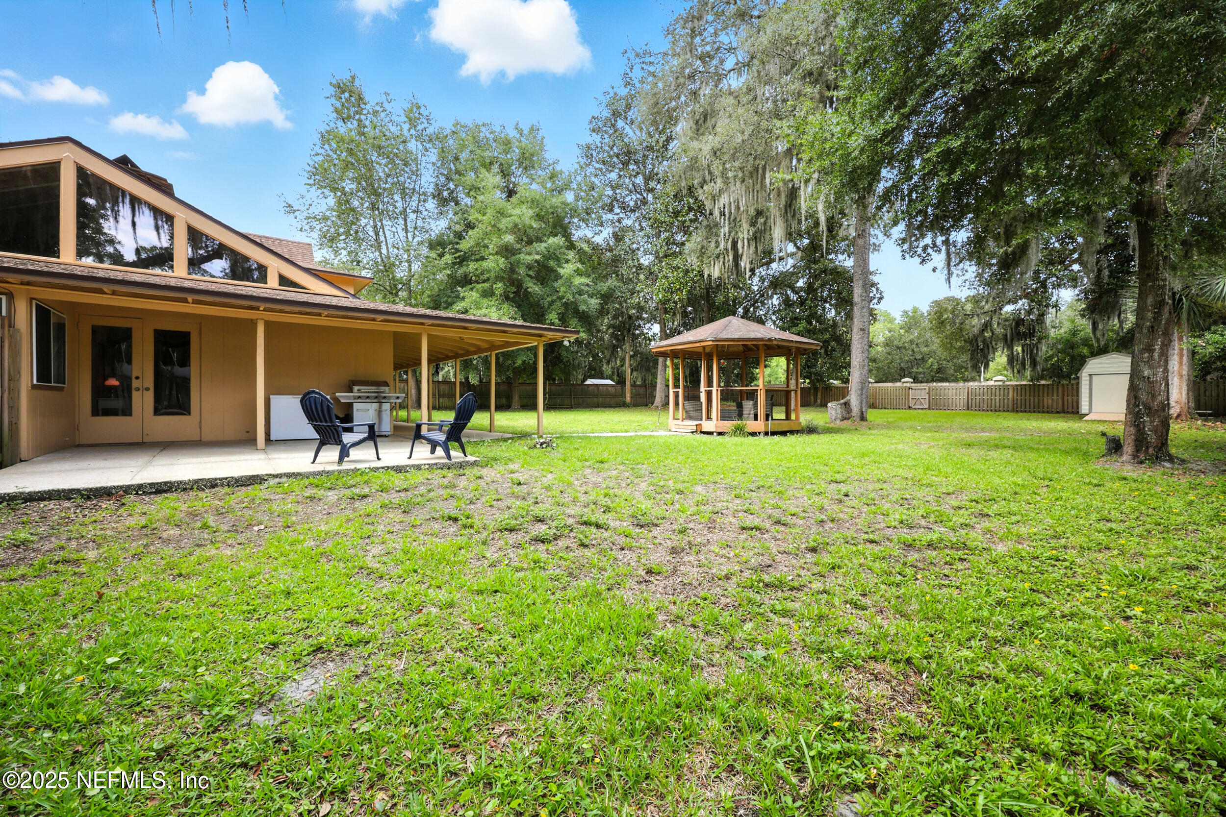 2712 Red Fox Road Orange Park, FL 32073 - Photo 25 of 30 a front view of a house with a yard table and chairs