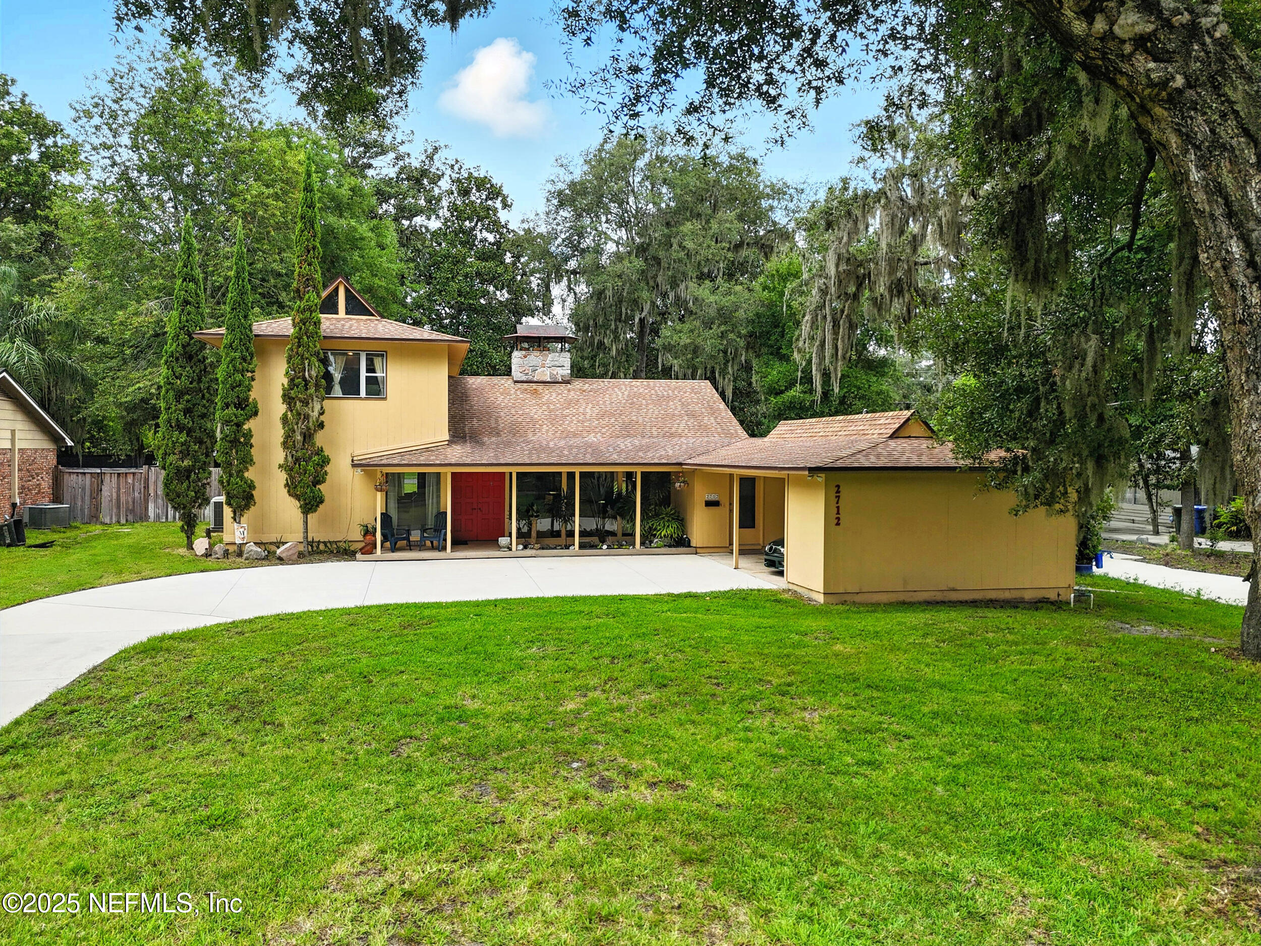 2712 Red Fox Road Orange Park, FL 32073 - Photo 28 of 30 a front view of a house with garden
