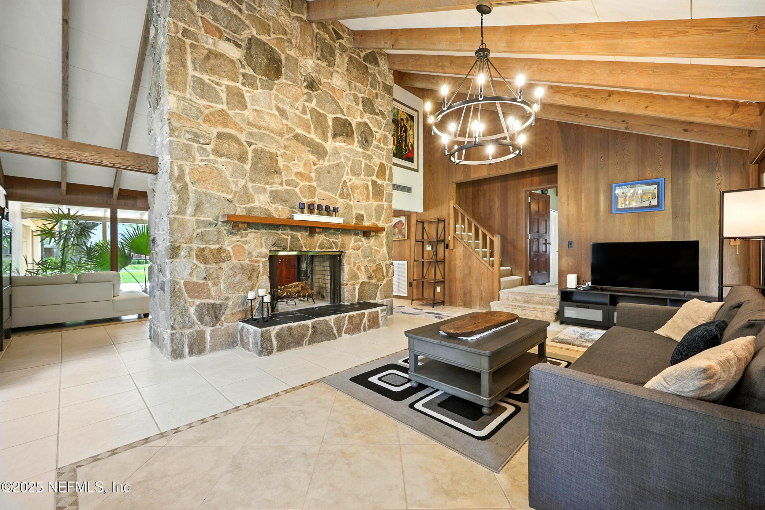 2712 Red Fox Road Orange Park, FL 32073 - Photo 7 of 30 a living room with furniture a flat screen tv and a fireplace