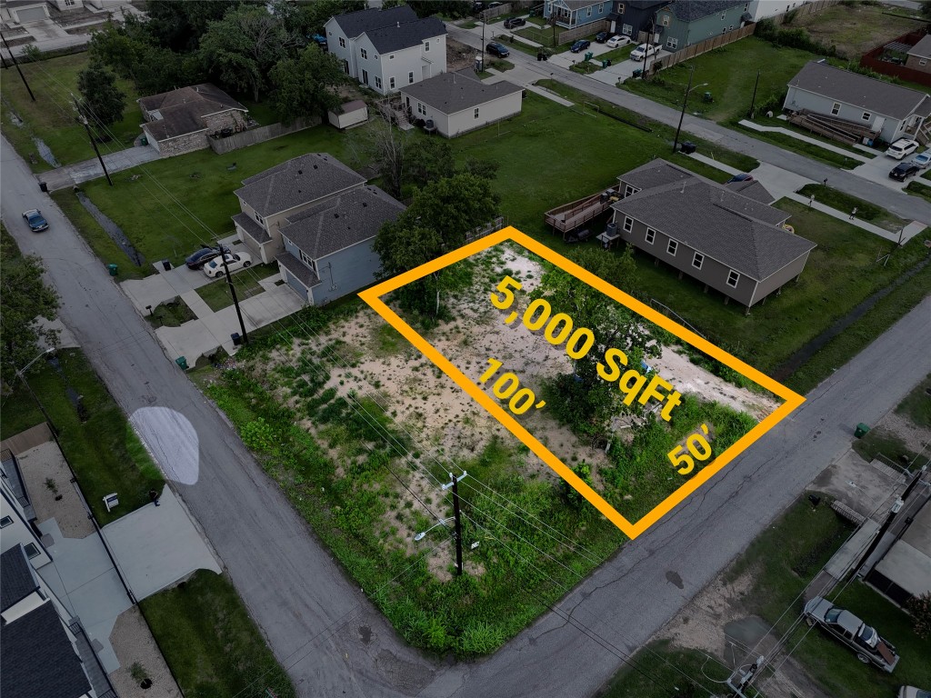 5510 Haight Street Houston, TX 77028 - Photo 1 of 26 an aerial view of a tennis ground with a large pool