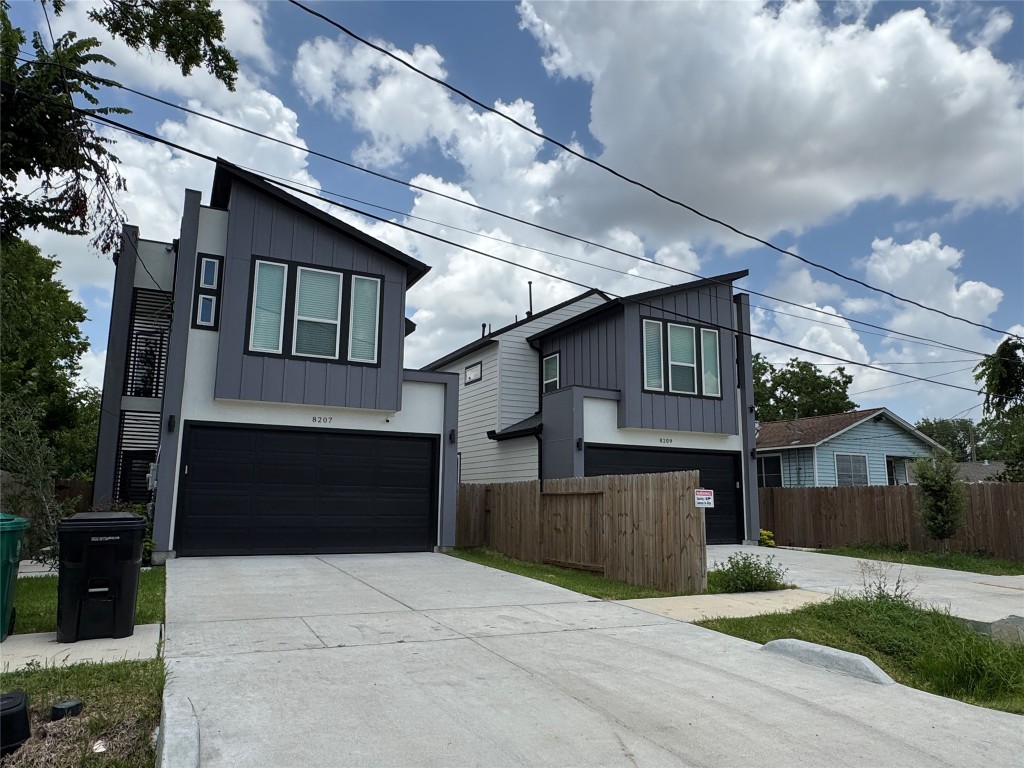5510 Haight Street Houston, TX 77028 - Photo 17 of 26 a front view of a house with a yard and garage