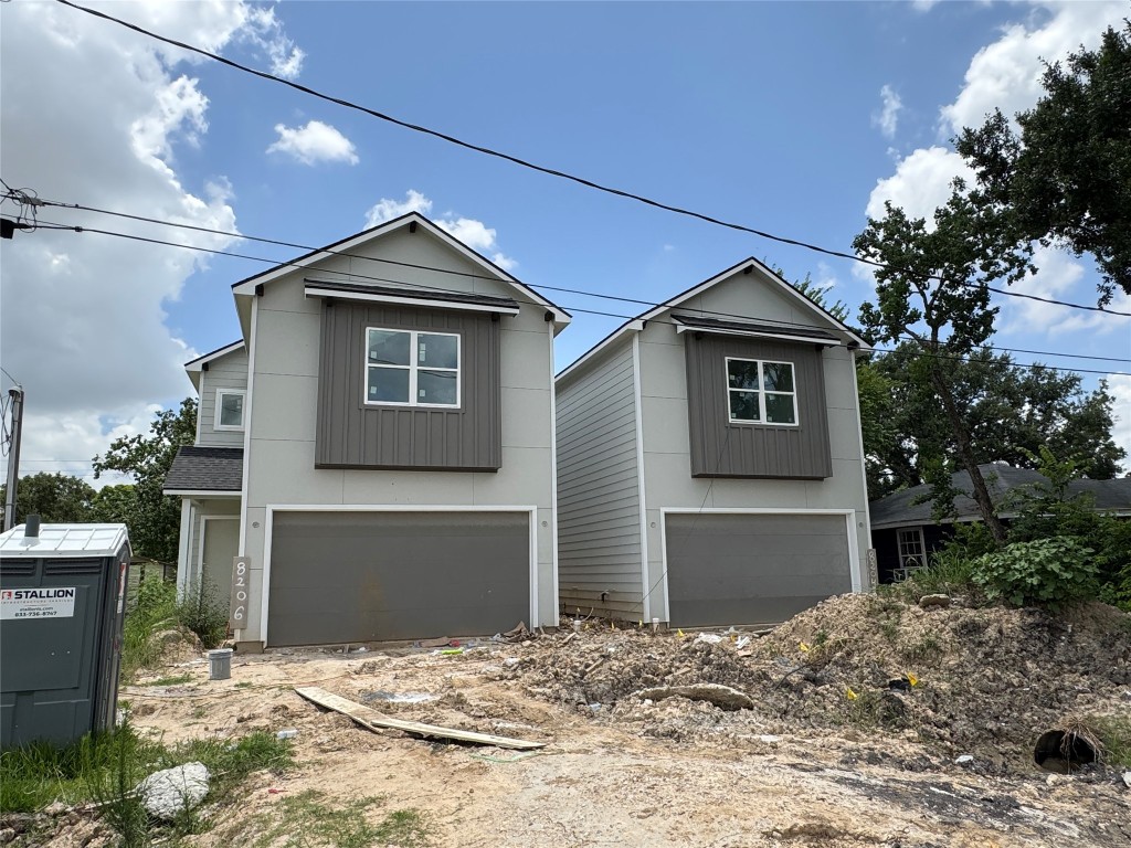 5510 Haight Street Houston, TX 77028 - Photo 21 of 26 a front view of a house with a yard and garage