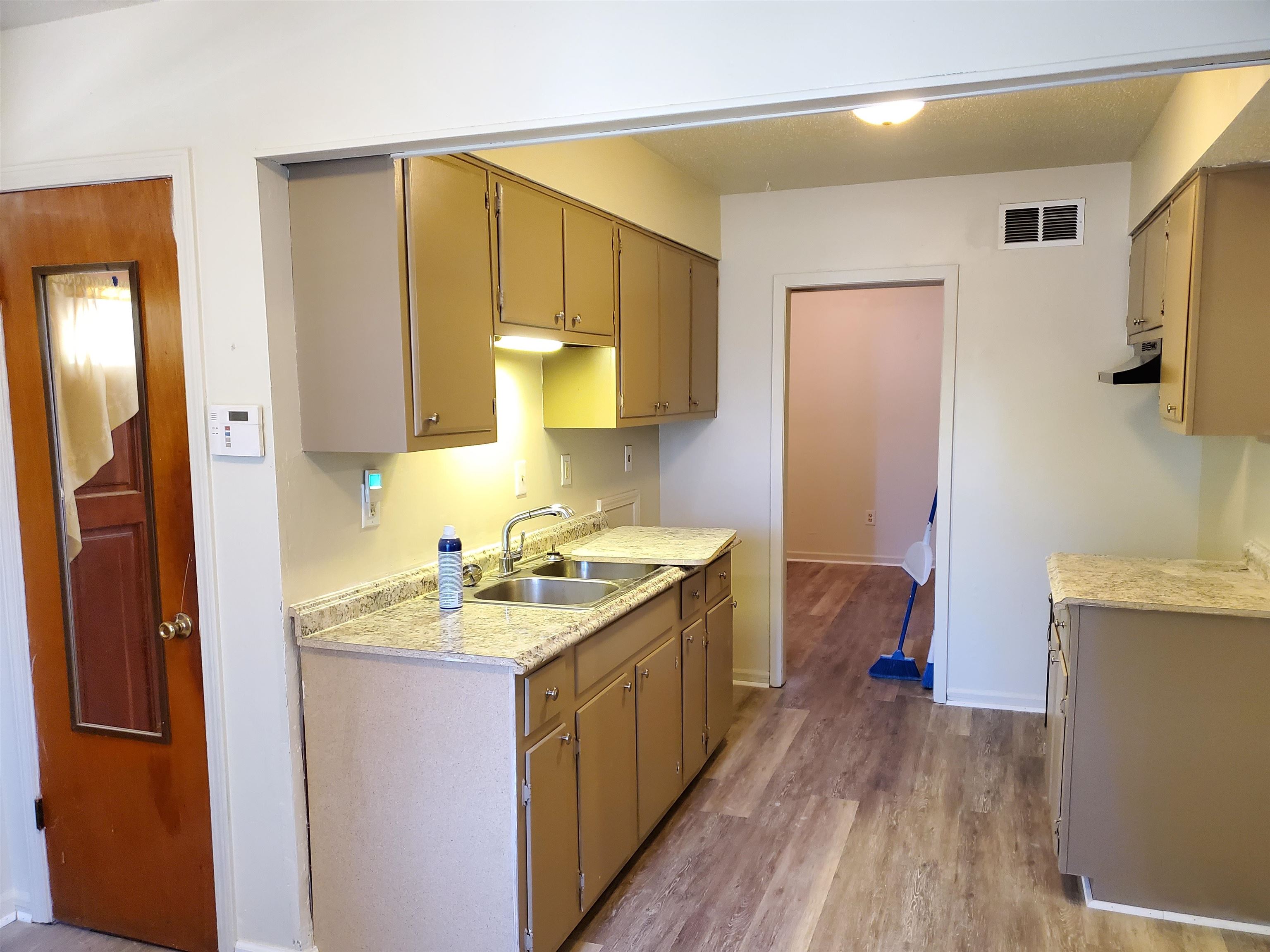 3440 Aaron Road Memphis, TN 38109 - Photo 4 of 16 a kitchen with a sink stove and refrigerator