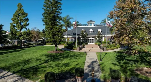 a aerial view of a house with a yard and potted plants