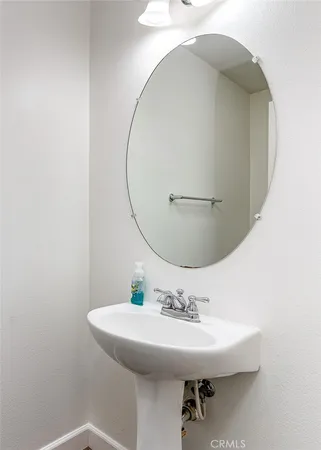 a bathroom with a sink and mirror