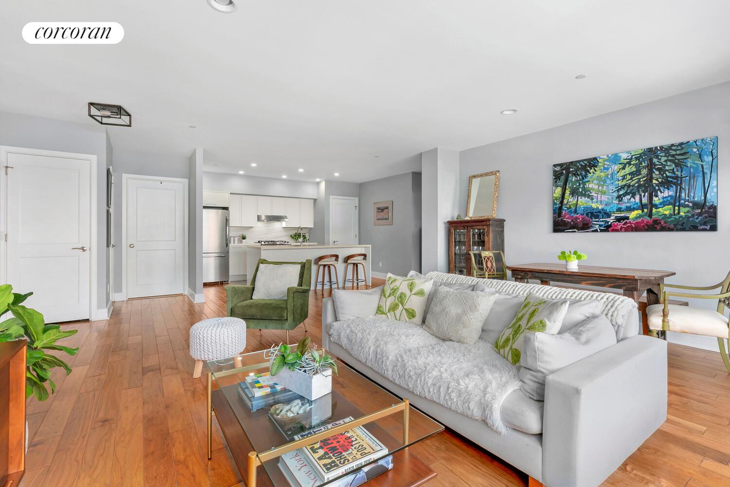 2255 Adam Clayton Powell Jr Boulevard, Unit 3A Manhattan, NY 10027 - Photo 3 of 9 a living room with furniture and a flat screen tv