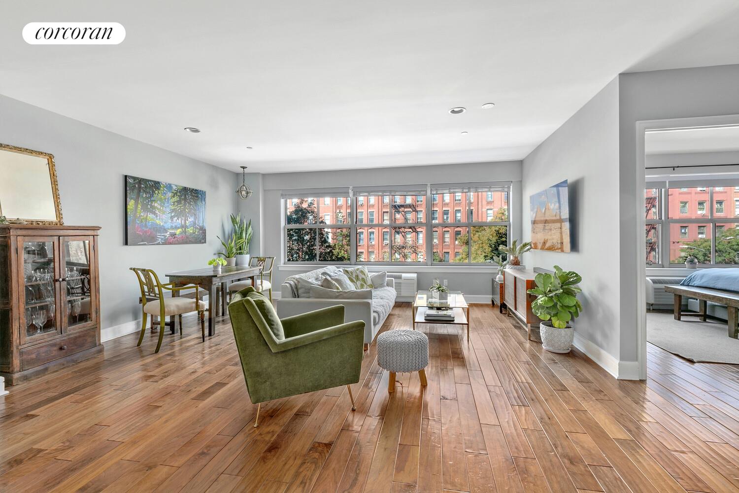 2255 Adam Clayton Powell Jr Boulevard, Unit 3A Manhattan, NY 10027 - Photo 7 of 9 a living room with furniture and a wooden floor
