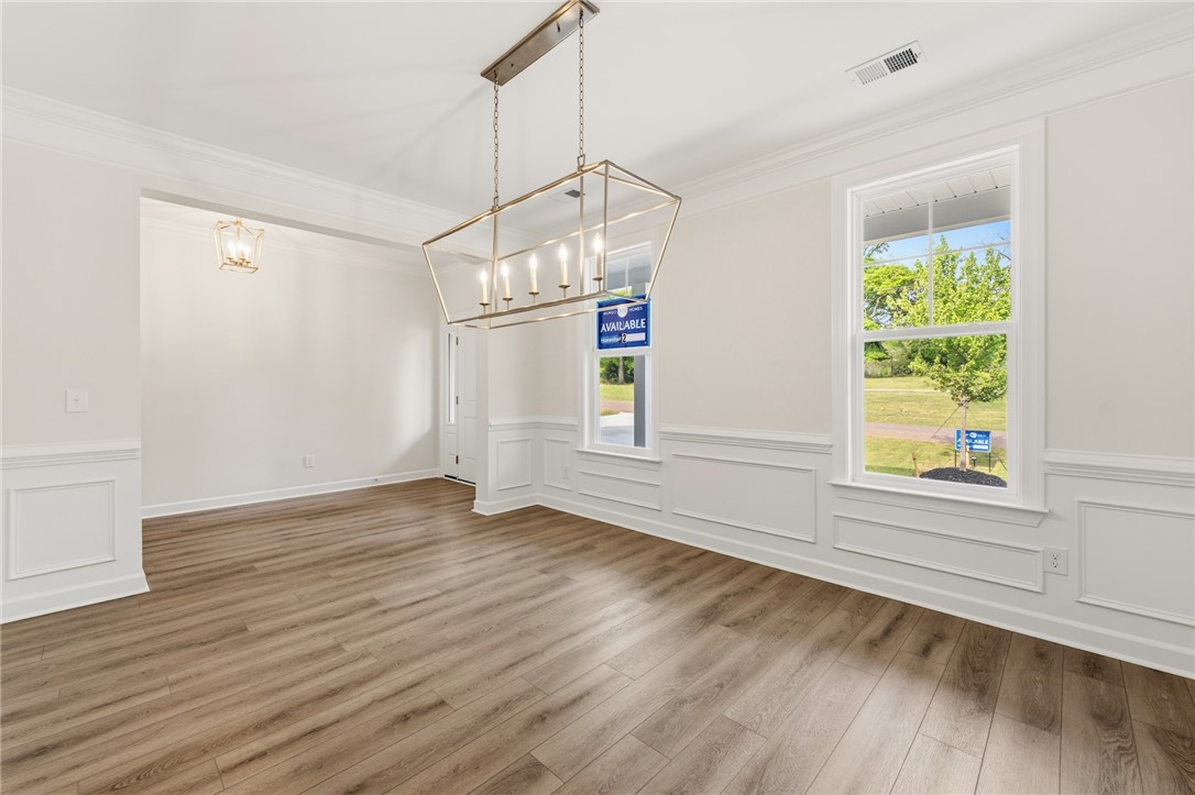1108 Manse Jolly Road Anderson, SC 29621 - Photo 6 of 45 This inviting dining room features elegant crown molding and wainscoting, with abundant natural light.