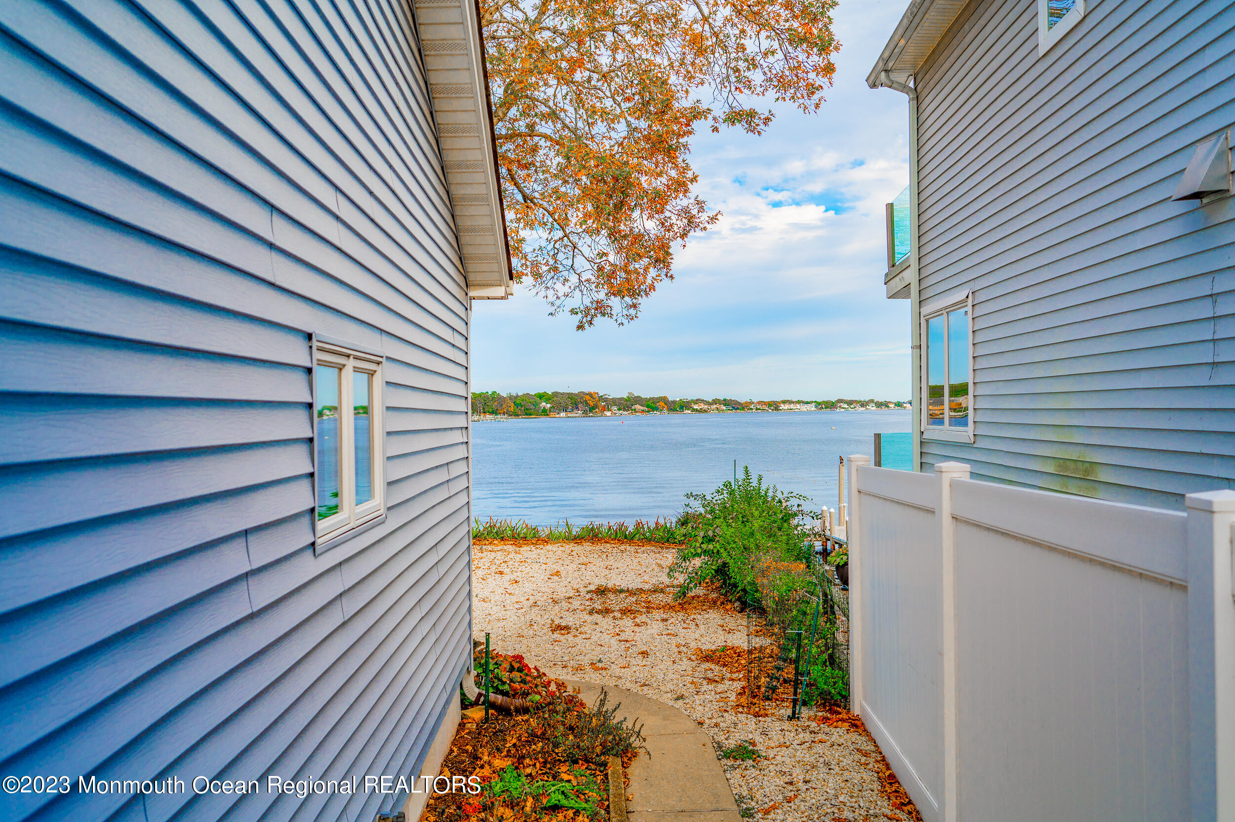 55 Edwards Road Brick, NJ 08723 - Photo 54 of 55 a view of a balcony with wooden floor and lake view