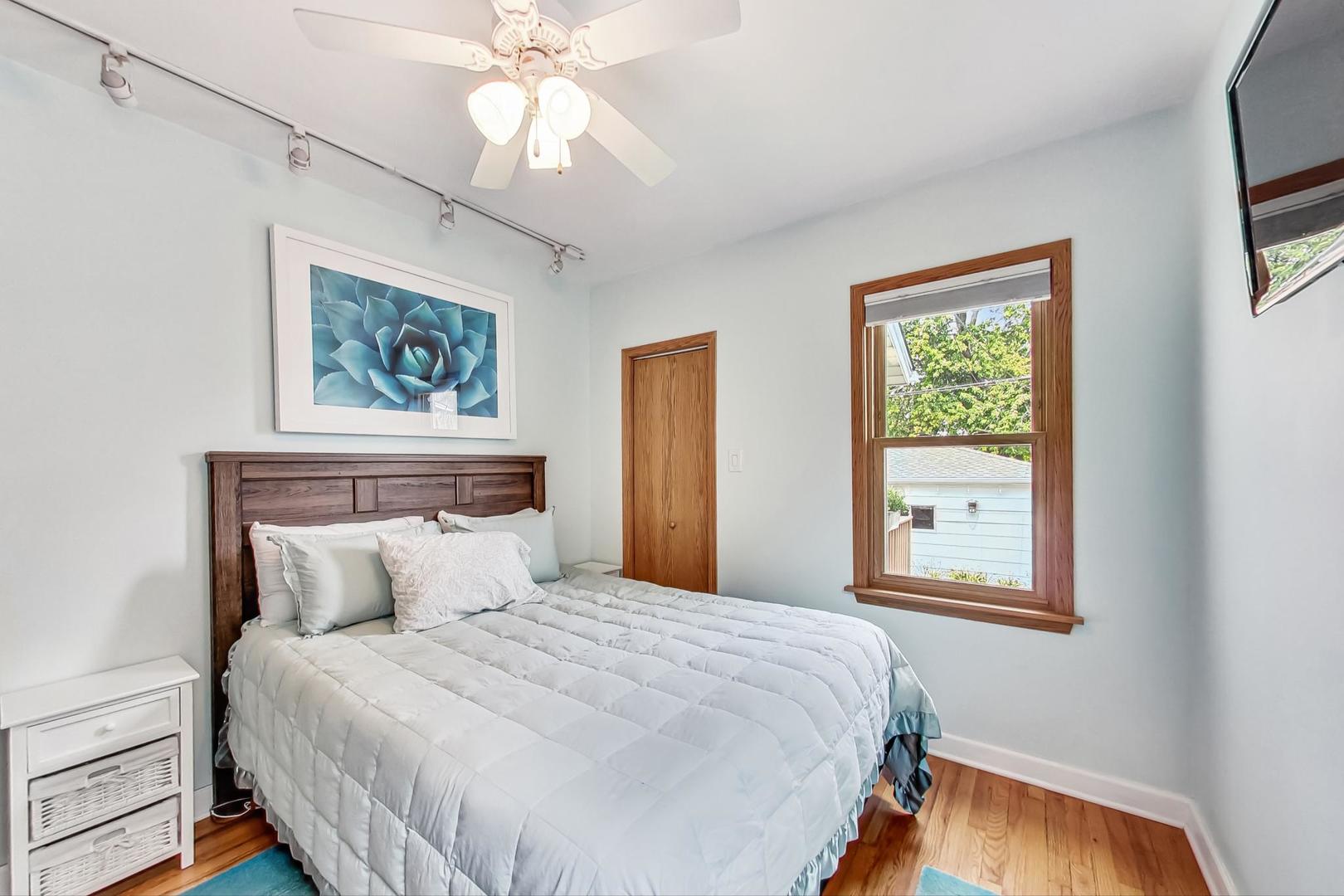 6322 West Huntington Street Chicago, IL 60646 - Photo 17 of 51 a bedroom with a bed and a window